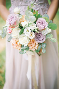Close-up of rose holding bouquet