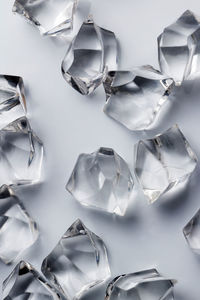 High angle view of crystals on white background