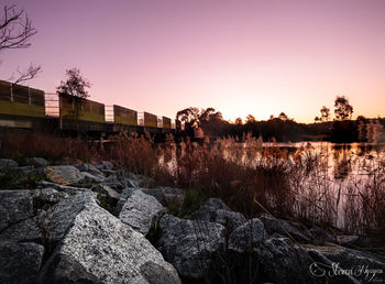 Scenic view of rocks against sky during sunset