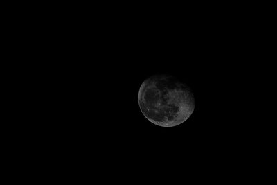 Low angle view of moon against sky at night
