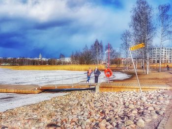 Men in park against sky