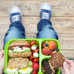 Low section of woman holding food