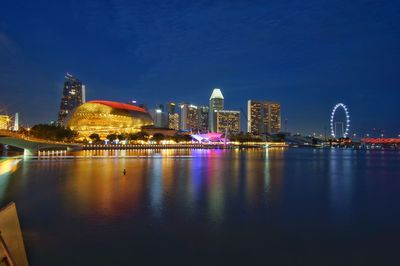 Illuminated city buildings at night