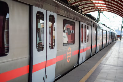 Blurred motion of train at railroad station