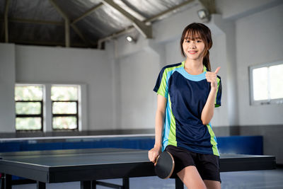 Young woman exercising in gym