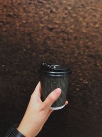 Close-up of person hand holding drink