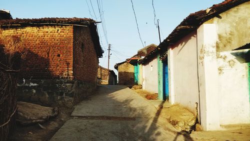 Street amidst buildings against sky