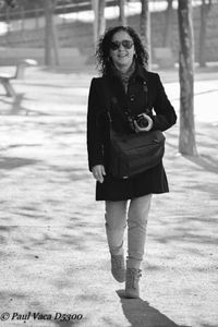 Portrait of a young woman standing outdoors