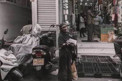 People standing on street in city