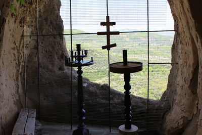 Electric lamp hanging by window in temple