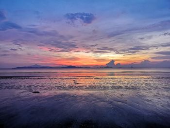 Scenic view of sea against romantic sky at sunset