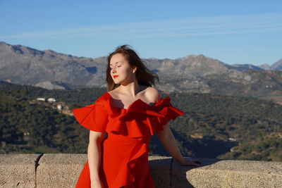 Woman in red dress enjoying the view