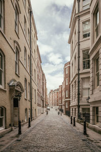 Empty alley amidst buildings