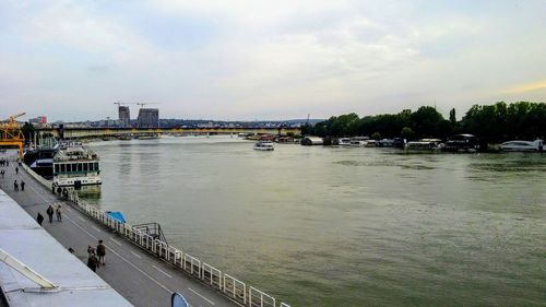 View of bridge over river against cloudy sky