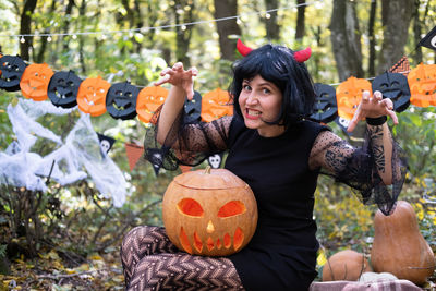 Halloween. young woman in halloween costume having fun outdoor