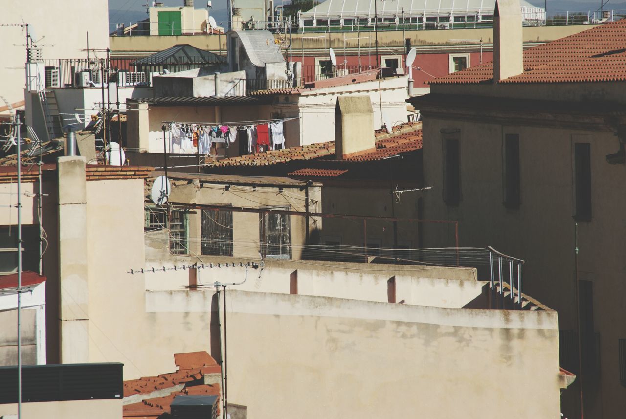 building exterior, architecture, built structure, residential building, residential structure, building, city, house, day, high angle view, residential district, window, outdoors, roof, balcony, no people, apartment, town, city life, sunlight