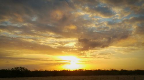 Scenic view of silhouette landscape against sky during sunset