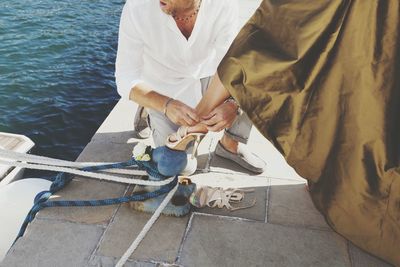 Close-up of woman standing in pond