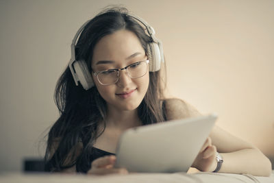 Young asian woman listened to music