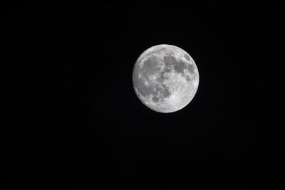 Low angle view of moon against sky at night