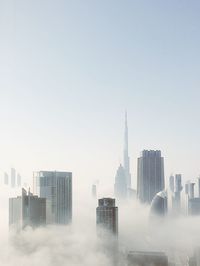 Skyscrapers in city against clear sky