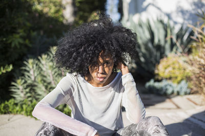 Young woman sitting outdoors