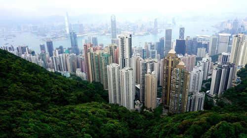 Panoramic view of modern buildings in city against sky