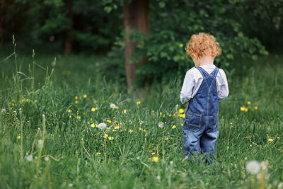 Full length of child standing on field