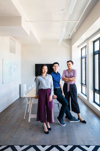 Full length portrait of a smiling young couple