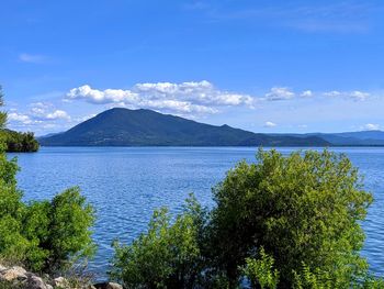 Scenic view of sea against blue sky