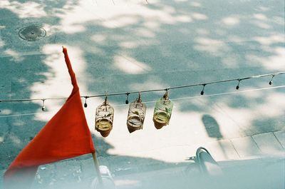 Low angle view of clothes hanging on clothesline against sky