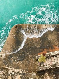 High angle view of waves splashing in sea