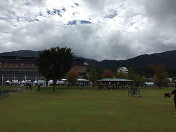 Buildings against cloudy sky