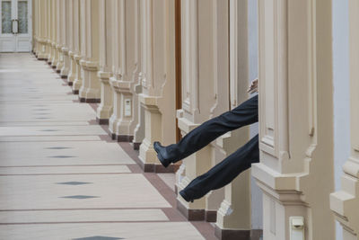 Low section of man on staircase in building