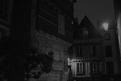 Buildings in city at night