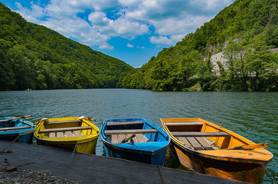 Boats moored in lake