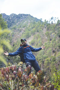 Rear view of man standing on field