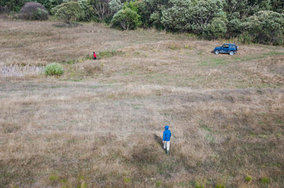 High angle view of person with umbrella on field