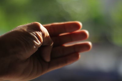Close-up of human hand in sunlight