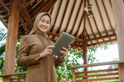 Young woman using digital tablet