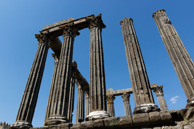 Low angle view of roman temple of evora against sky