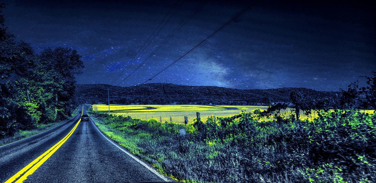 road, transportation, plant, night, sky, nature, the way forward, scenics - nature, no people, beauty in nature, tree, darkness, landscape, light, star, tranquility, tranquil scene, environment, land, horizon, road marking, diminishing perspective, outdoors, vanishing point, sign, non-urban scene, marking, growth, symbol, country road, rural scene, street, morning