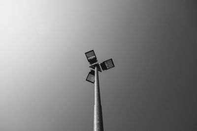 Low angle view of communications tower against sky