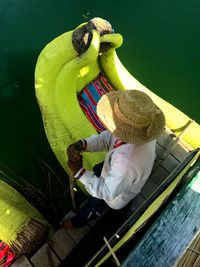 High angle view of people sitting on boat