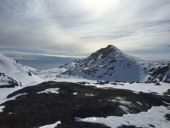 Scenic view of snow covered mountains