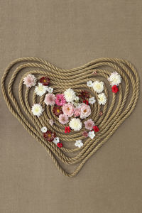 High angle view of heart shapes on jute