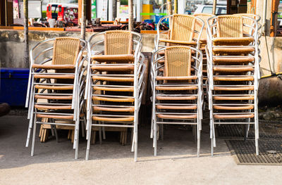 Stack of empty chairs at table
