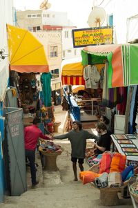 People at market stall in city