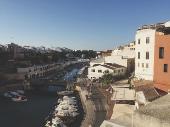 High angle view of river amidst buildings in city against sky