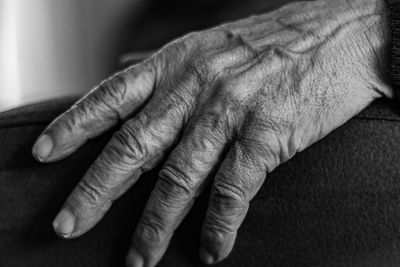 Close-up of a hand of an old man, black and white photo